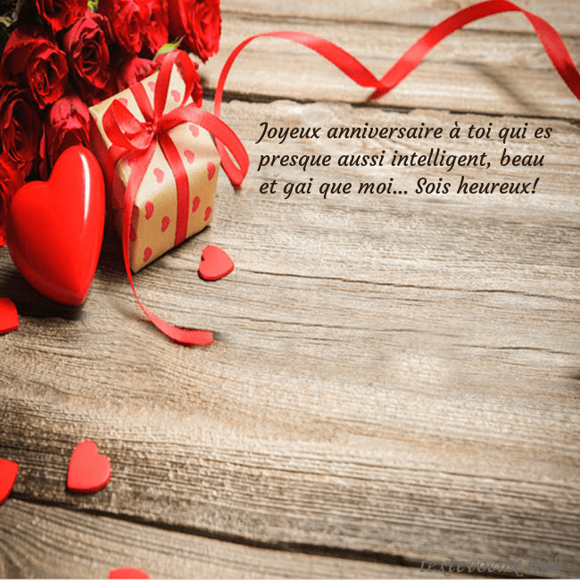 Carte de vœux avec coeur rouge et cadeau